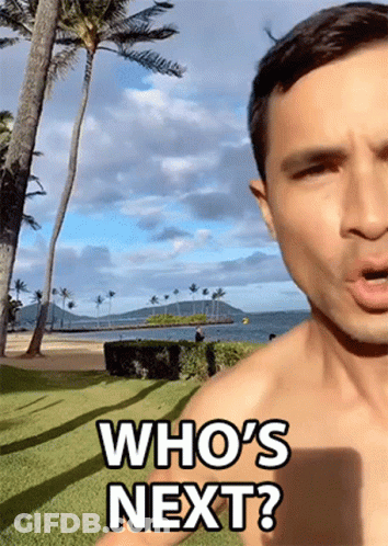 Shirtless Man Saying Who's Next At Beach GIF
