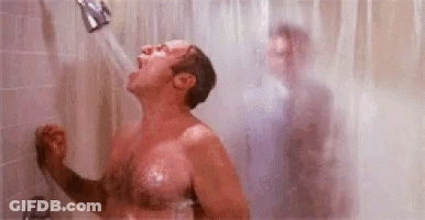 Shirtless Man Showering With Another Man Behind GIF