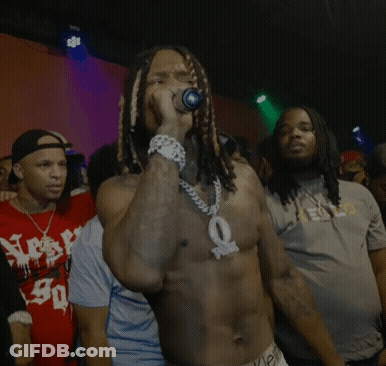 Shirtless Man Singing Into Microphone For Crowd GIF