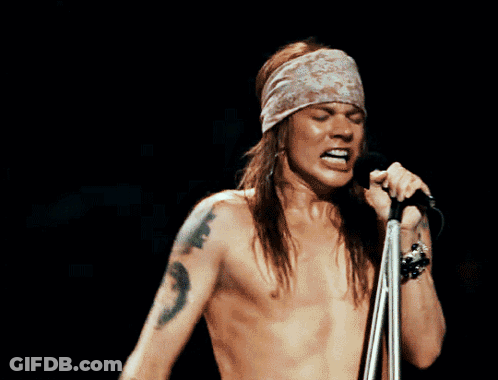 Shirtless Man Singing Into Microphone Mouth Open GIF