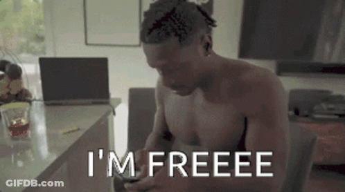 Shirtless Man Sits Laptop Says I'm Freeee On Phone GIF