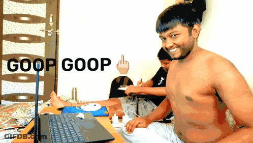 Shirtless Man Sitting At Laptop With Goop Goop On Wall GIF