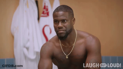 Shirtless Man Sitting By Laugh Out Loud Sign GIF