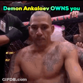 Shirtless Man Sitting In Cage Saying Demon Ankalaev Owns You GIF