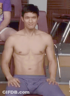 Shirtless Man Sitting In Chair With Pants Down GIF