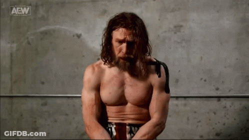 Shirtless Man Sitting In Front Of AEW Logo GIF