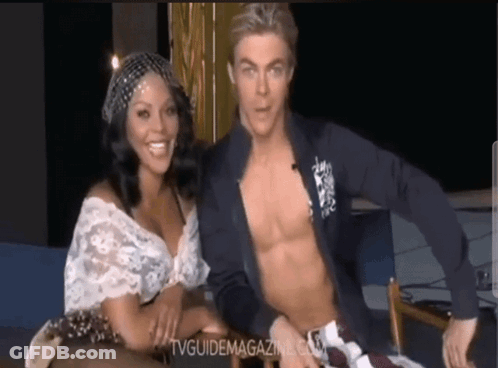 Shirtless Man Sitting Next To Woman With TVGuideMagazine.com GIF