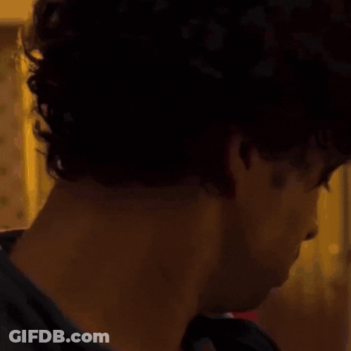 Shirtless Man Standing Before UFC Sign GIF