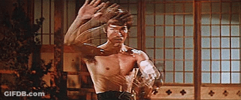 Shirtless Man Standing By Window GIF