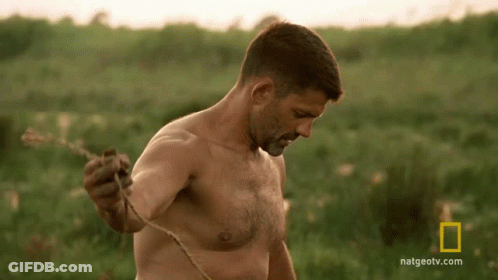 Shirtless Man Standing In Field GIF