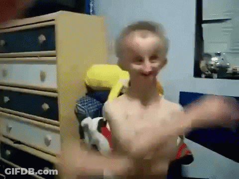 Shirtless Man Standing In Front Of Dresser GIF