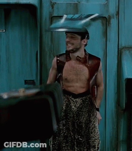 Shirtless Man Standing In Front Of Emergency Exit Door GIF