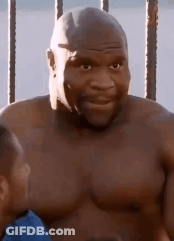 Shirtless Man Standing In Front Of Fence GIF