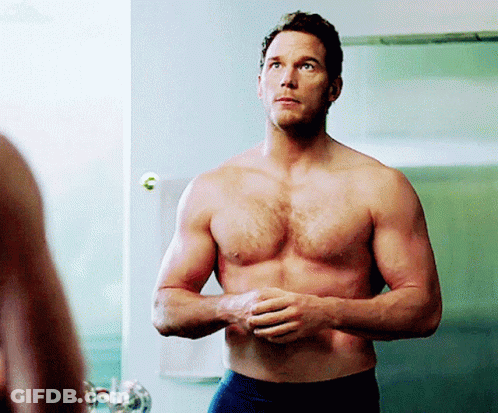 Shirtless Man Standing In Front Of Mirror GIF