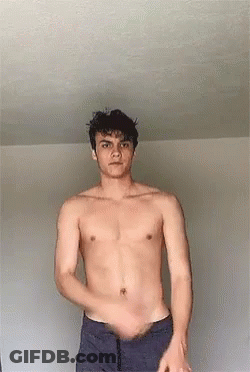 Shirtless Man Standing In Front Of Wall GIF