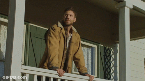 Shirtless Man Standing In Front Of White Wall GIF