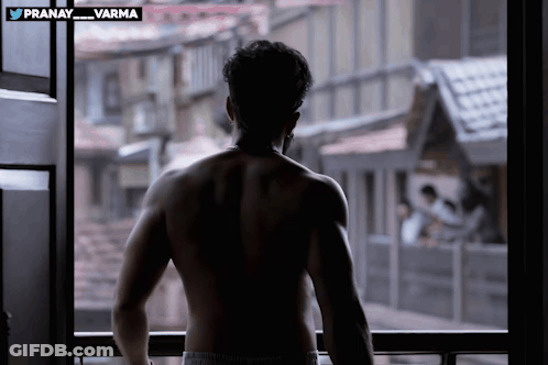 Shirtless Man Standing In Front Of Window Pranay Varma GIF