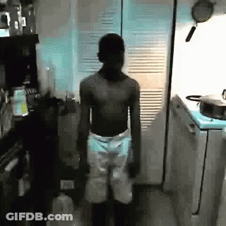 Shirtless Man Standing In Kitchen GIF