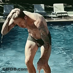 Shirtless Man Standing In Pool With Hand On Head GIF