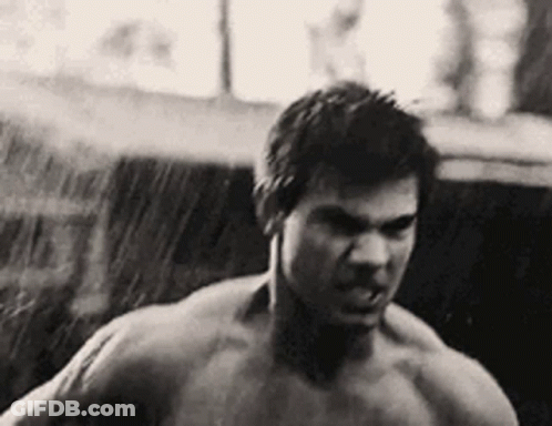 Shirtless Man Standing In Rain GIF