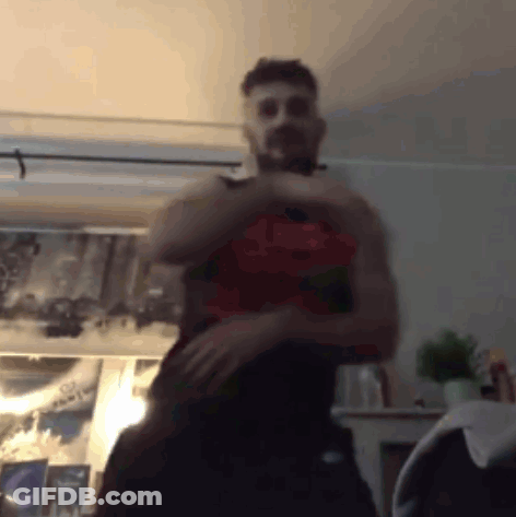 Shirtless Man Standing In Room With Picture GIF