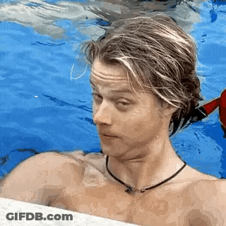 Shirtless Man Standing In Swimming Pool GIF