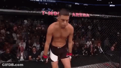 Shirtless Man Standing In UFC Cage GIF