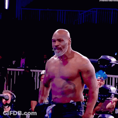 Shirtless Man Standing In Wrestling Ring GIF