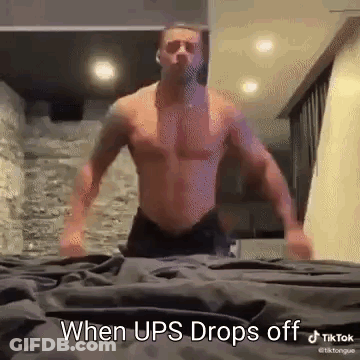 Shirtless Man Standing On Bed When UPS Drops Off GIF