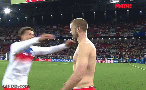 Shirtless Man Tackled On Soccer Field With Math Sign GIF