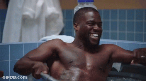Shirtless Man Taking Bath In Bathtub With Hose GIF