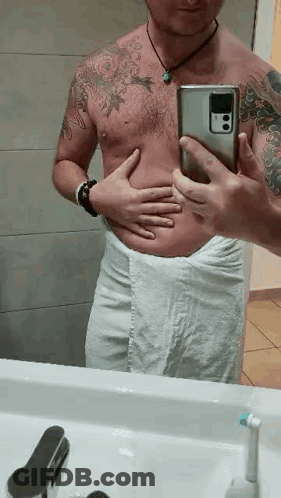 Shirtless Man Taking Bathroom Mirror Selfie GIF