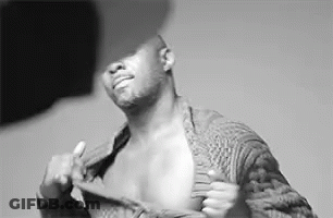 Shirtless Man Taking Off Sweater Black And White GIF
