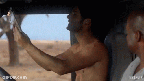 Shirtless Man Taking Selfie In Car GIF