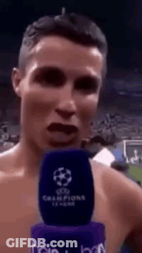 Shirtless Man Talking Into Champions League Microphone GIF