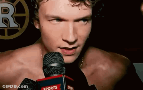 Shirtless Man Talking Into Sports Microphone GIF