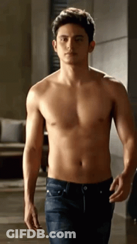 Shirtless Man Walking Down Hallway GIF
