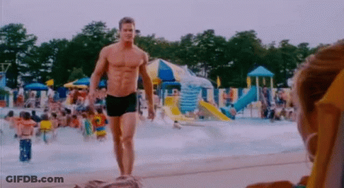Shirtless Man Walking Water Park GIF