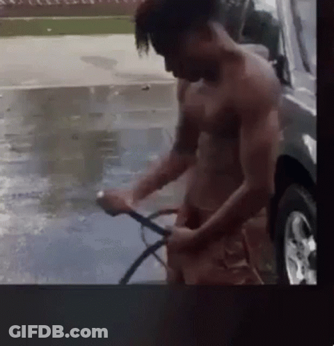 Shirtless Man Washing Car With Hose GIF