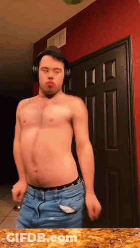 Shirtless Man Wearing Headphones Dancing In Front Of Door GIF