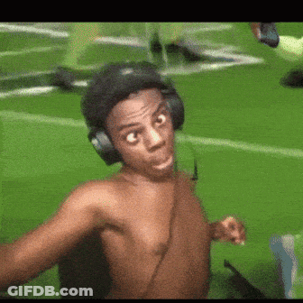 Shirtless Man Wearing Headphones Taking Selfie On Field GIF