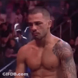 Shirtless Man With Arm Tattoo In Boxing Ring GIF