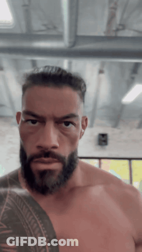Shirtless Man With Beard And Arm Tattoo GIF