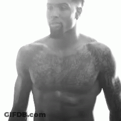Shirtless Man With Beard And Chest Tattoos GIF