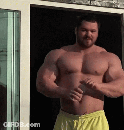 Shirtless Man With Beard By Glass Door GIF