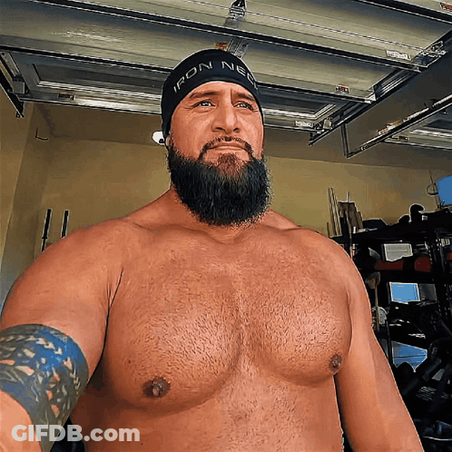 Shirtless Man With Beard In Black Beanie Saying Iron Nerd GIF