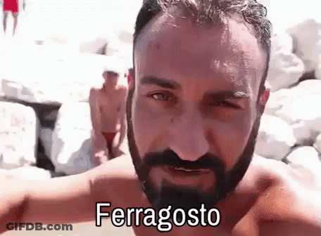 Shirtless Man With Beard In Front Of Rock Wall GIF