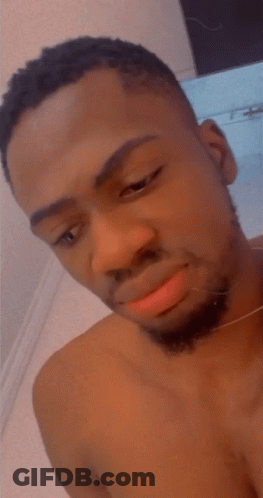 Shirtless Man With Beard Looking Up GIF
