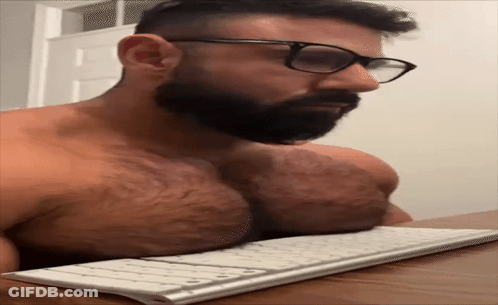 Shirtless Man With Beard Typing On Keyboard GIF