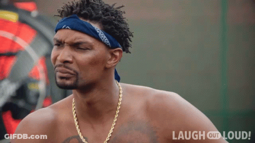 Shirtless Man With Blue Bandana And Gold Chains Saying Laugh Out Loud GIF